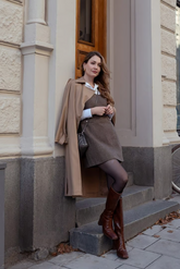 a lady in a brown dress and a brown coat
